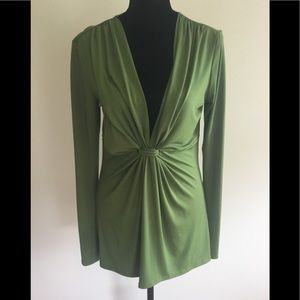 Green colored pull-on top with low cut neck with ruching center, long sleeves.